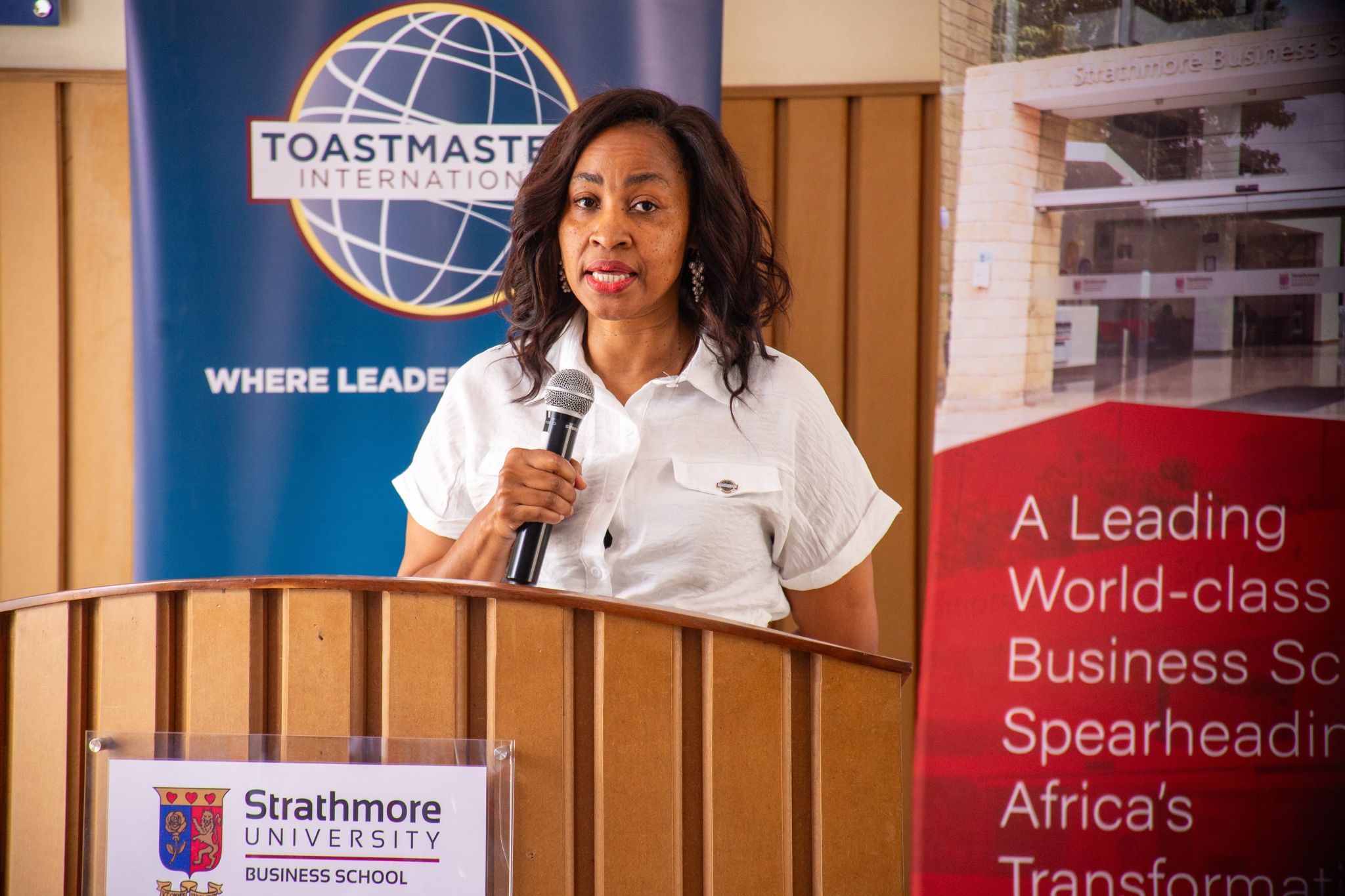Princess speaking mid-speech holding mic